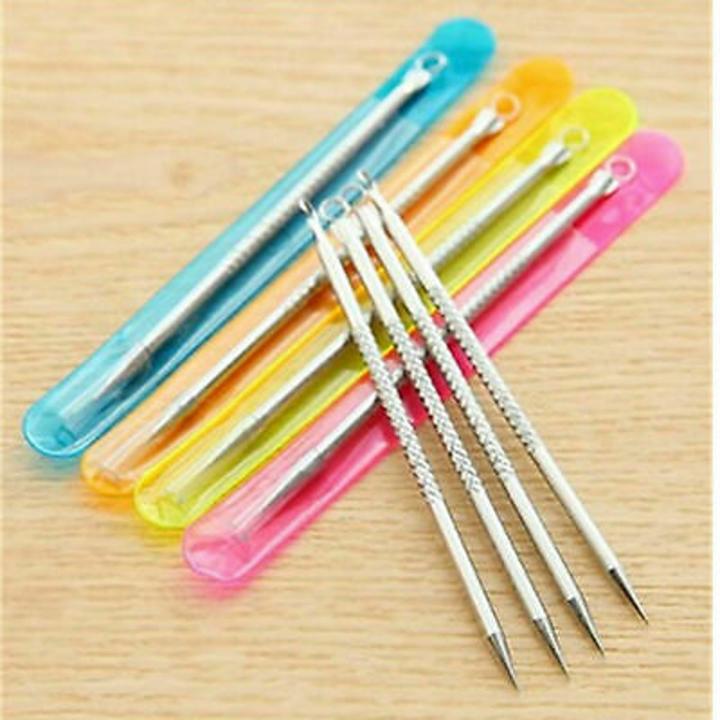 Five metal blackhead remover tools with textured handles and colorful protective cases.