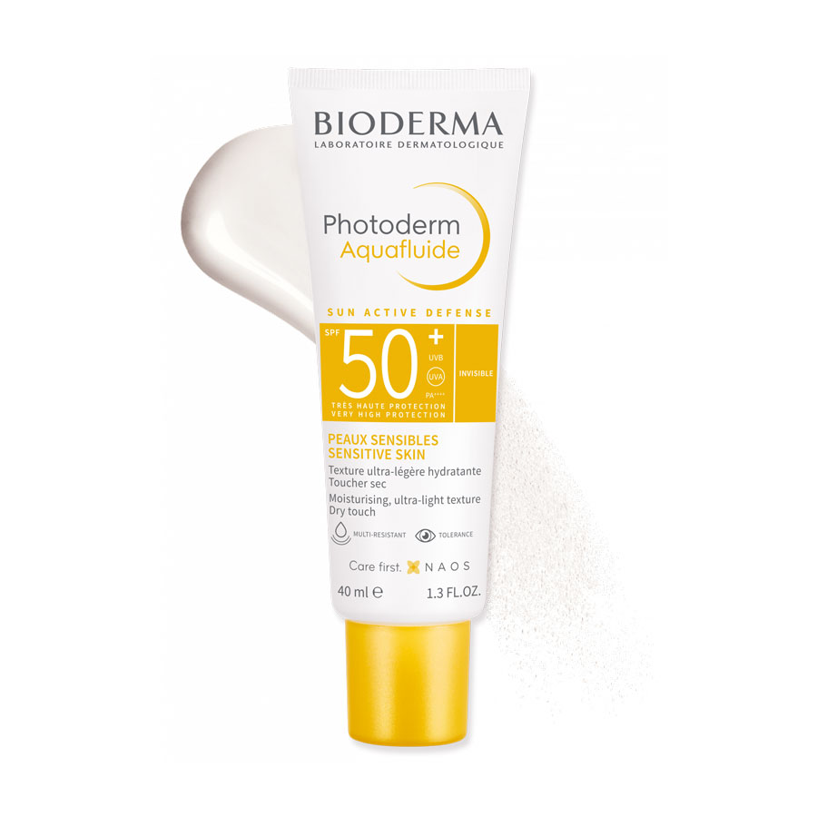 Bioderma Photoderm Aquafluide SPF 50+ sunscreen tube with yellow cap and swatch.