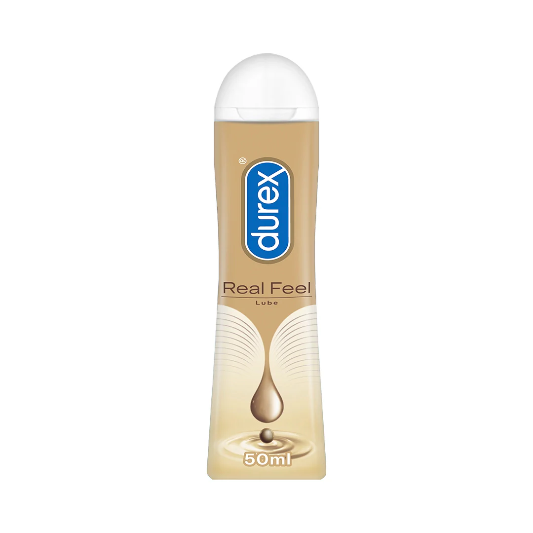 Durex Real Feel lubricant bottle with a gold label and white cap.