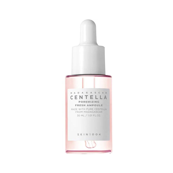 Clear serum bottle with a white dropper cap and pink-tinted liquid inside.
