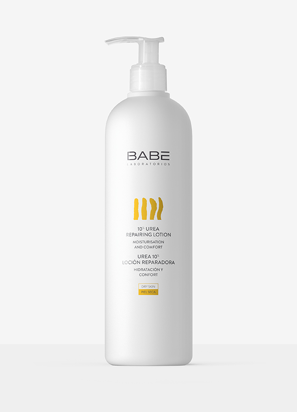 White bottle of BABÉ shampoo with yellow label and pump dispenser on a light background.