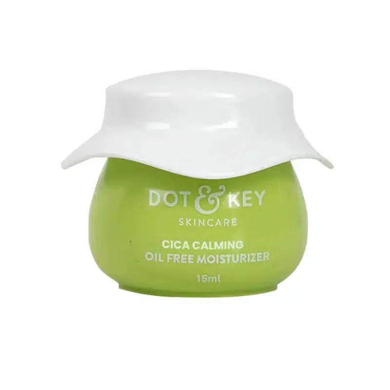 Dot & Key green moisturizer jar with a white curved lid.