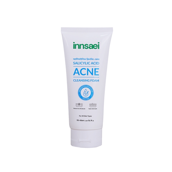 White tube of Innisai Acne Cleansing Foam with blue and green text.