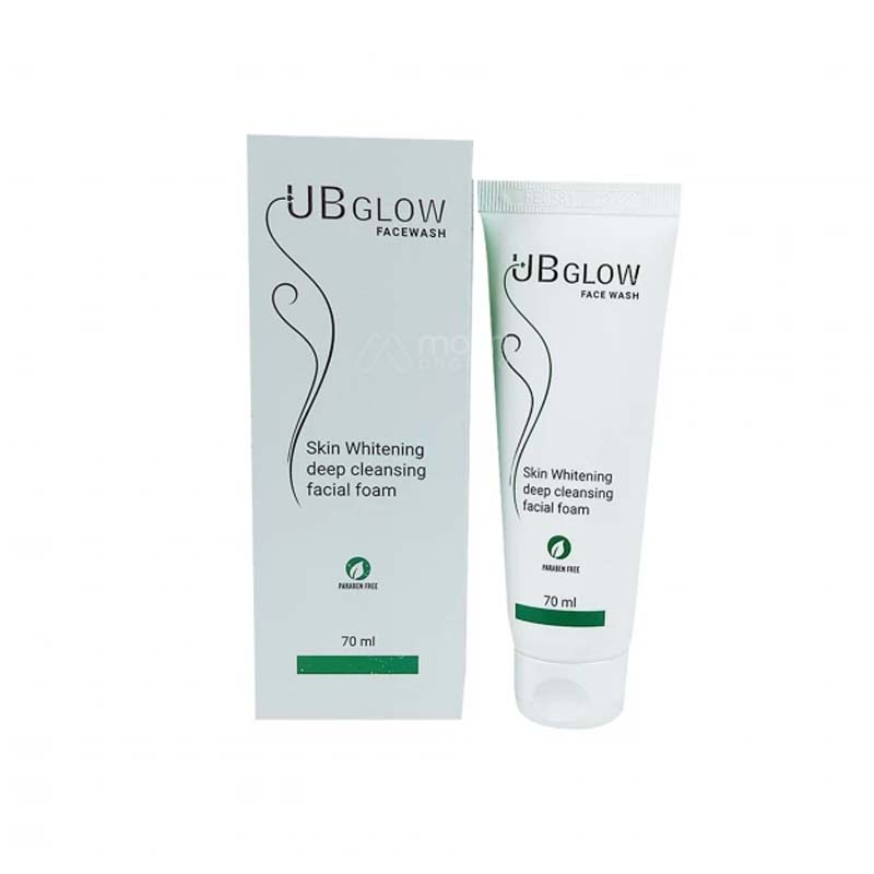 White tube and box of UB Glow skin whitening facial foam with green accents.