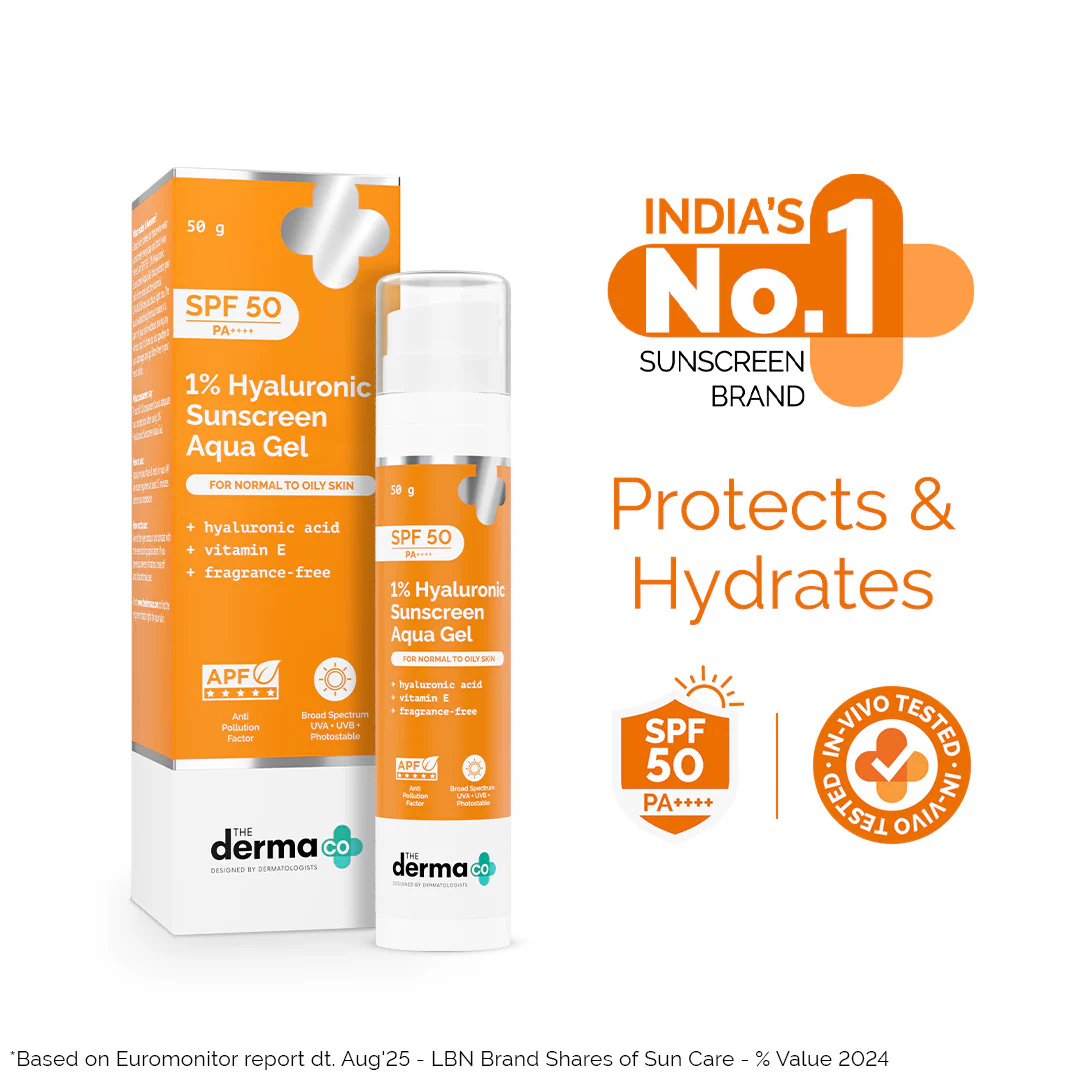 Derma Co. sunscreen packaging and bottle in orange and white with SPF 50 highlights.