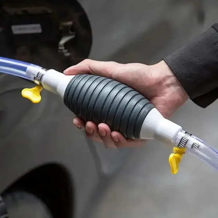 Fuel transfer pump with flexible hoses  valves.