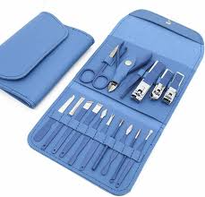 Blue manicure and pedicure set with various grooming tools in a matching case.