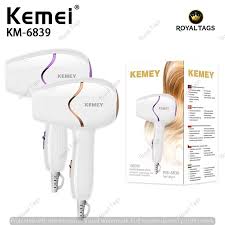 White Kemei KM-6839 hair dryer with product packaging shown upright.