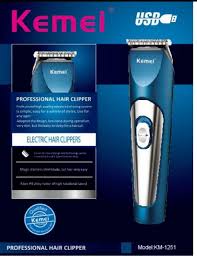 Blue and silver Kemei professional hair clipper with product details and model number on the box.