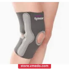 Person wearing a black and gray knee brace with an open patella design.