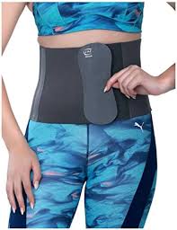 Person wearing a gray waist support belt over blue patterned athletic wear.