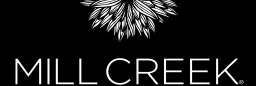 Mill Creek Botanicals logo with a stylized floral graphic on a black background.