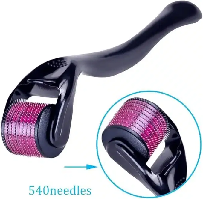 Black-handled derma roller with pink microneedles, close-up showing needle detail.
