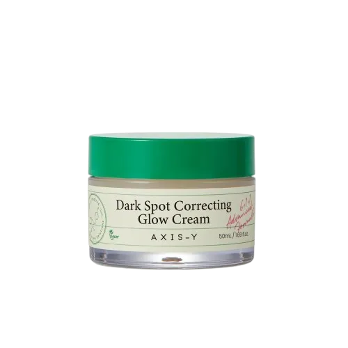 সবুজ ঢাকনাযুক্ত একটি ডার্ক স্পট করেক্টিং গ্লো ক্রিমের কাচের জার