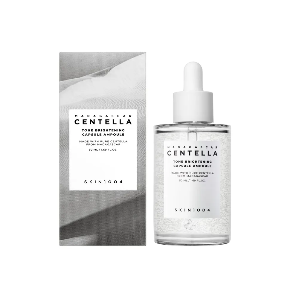 Clear dropper bottle and box of SKIN1004 Centella serum with white and gray design.