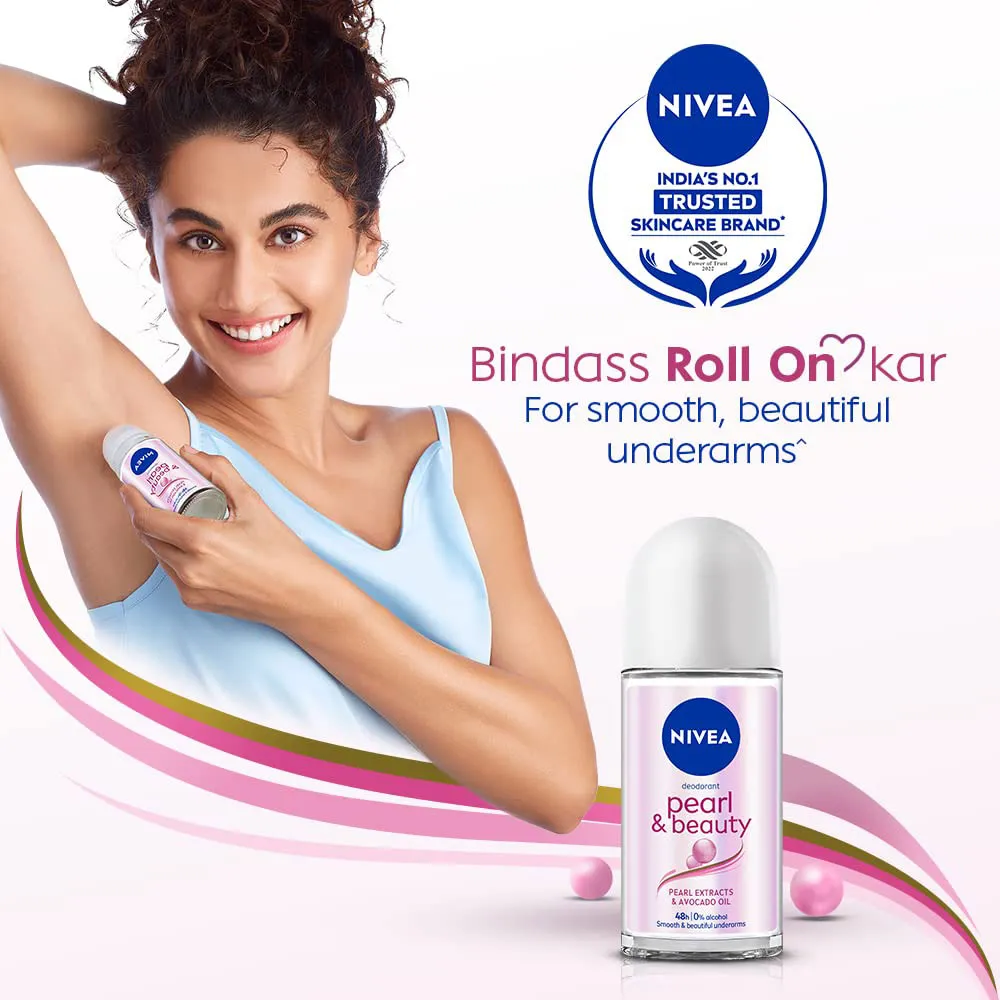 Smiling woman applying Nivea roll-on deodorant to her underarm, product bottle in foreground.