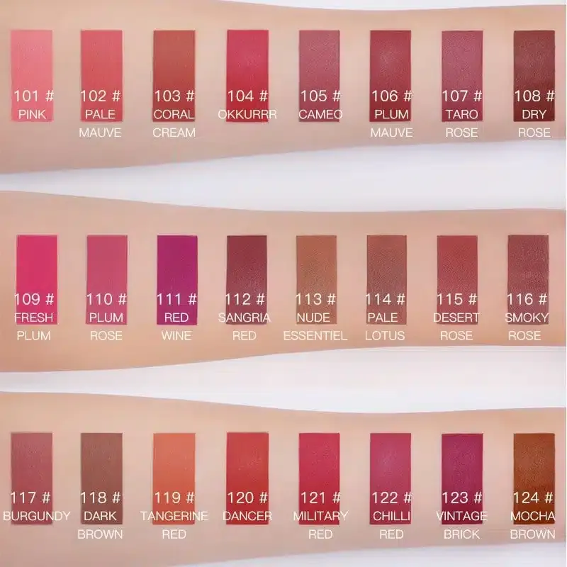 Swatches of twenty liquid lipsticks in various pink, red, peach, and brown shades on skin.