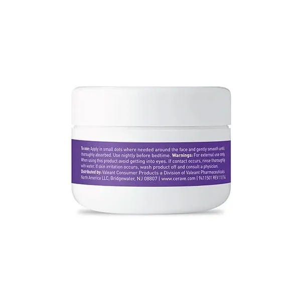 White cosmetic jar with a purple label and white text on a plain background.