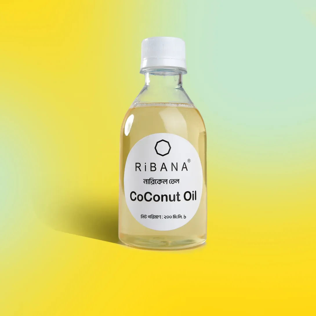 Clear bottle of Ribana coconut oil with a white label on a yellow and green background.