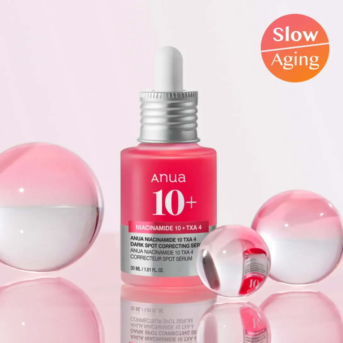 Pink serum bottle with dropper, surrounded by pink water spheres on a light background.