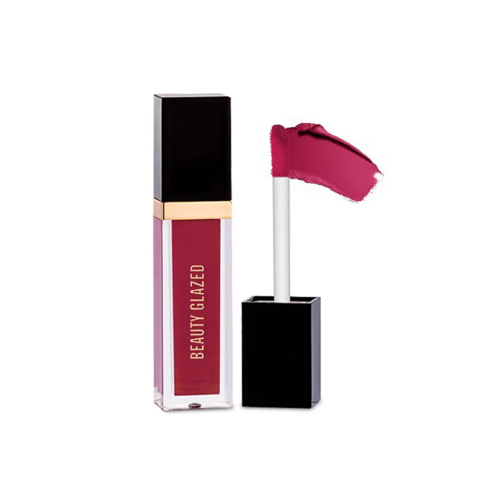 Liquid lipstick tube with dark pink applicator and gold accent on the cap.