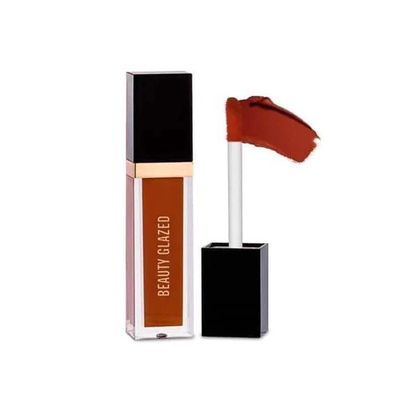 Liquid lipstick with a black cap and brownish-red color swatch on the applicator wand.