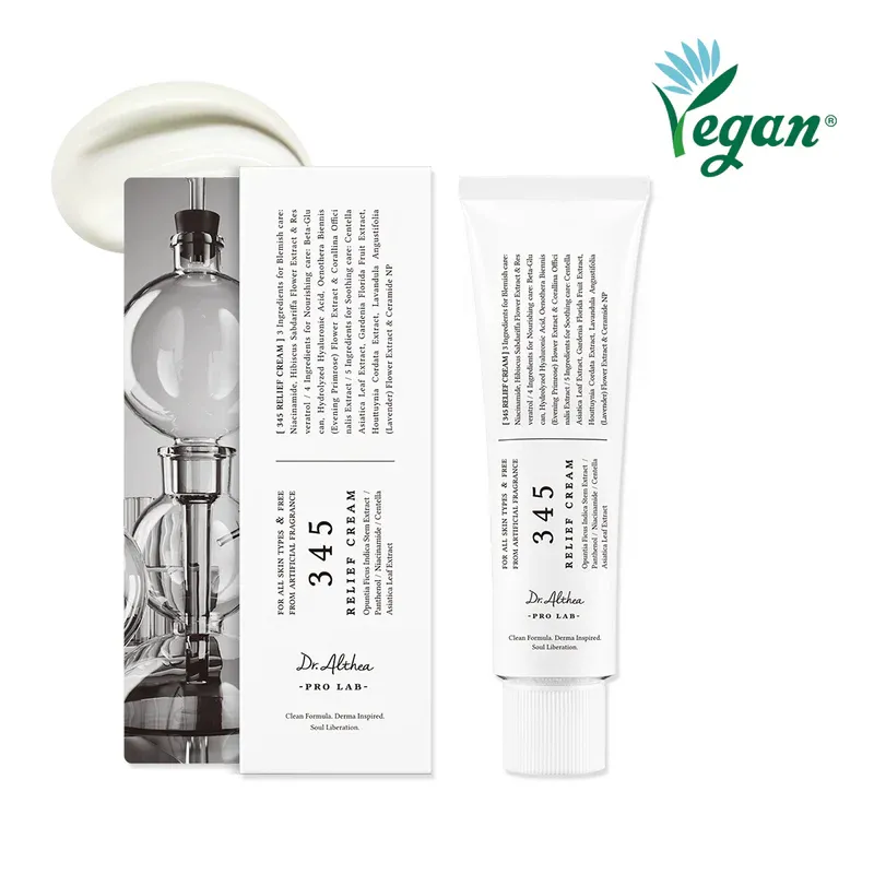 White tube of skincare cream with box, vegan logo in green, cream smear above.