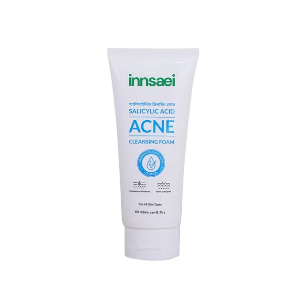 White tube of Innisai Acne Cleansing Foam with blue and green text.