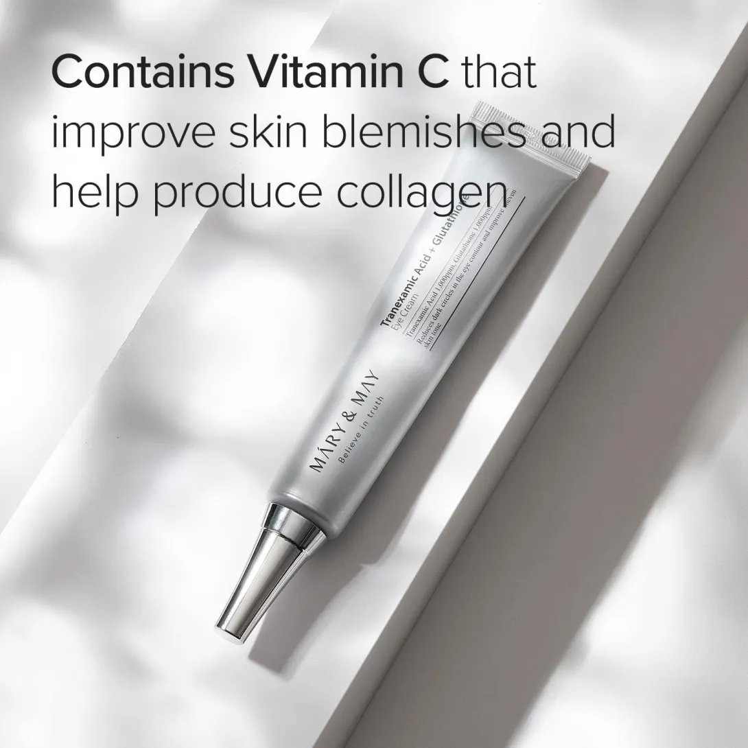 Silver tube of skincare cream on a white surface with soft natural light shadows.