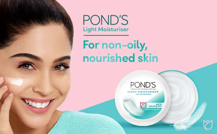 Smiling woman applying Pond's moisturizer cream, product tub and lid shown on a pastel background.