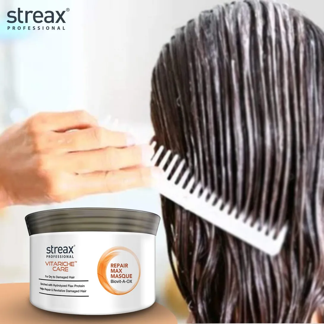 Hand combing hair with conditioner, Streax hair masque container in foreground.