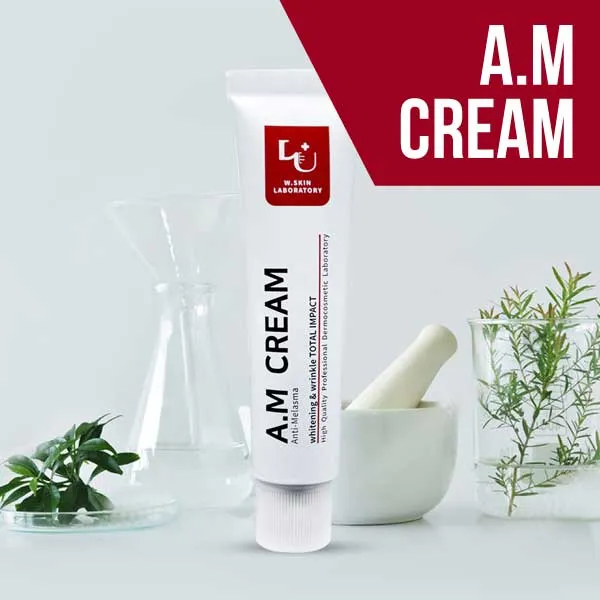 White tube of A.M cream with herbs, a mortar and pestle, and glassware in the background.
