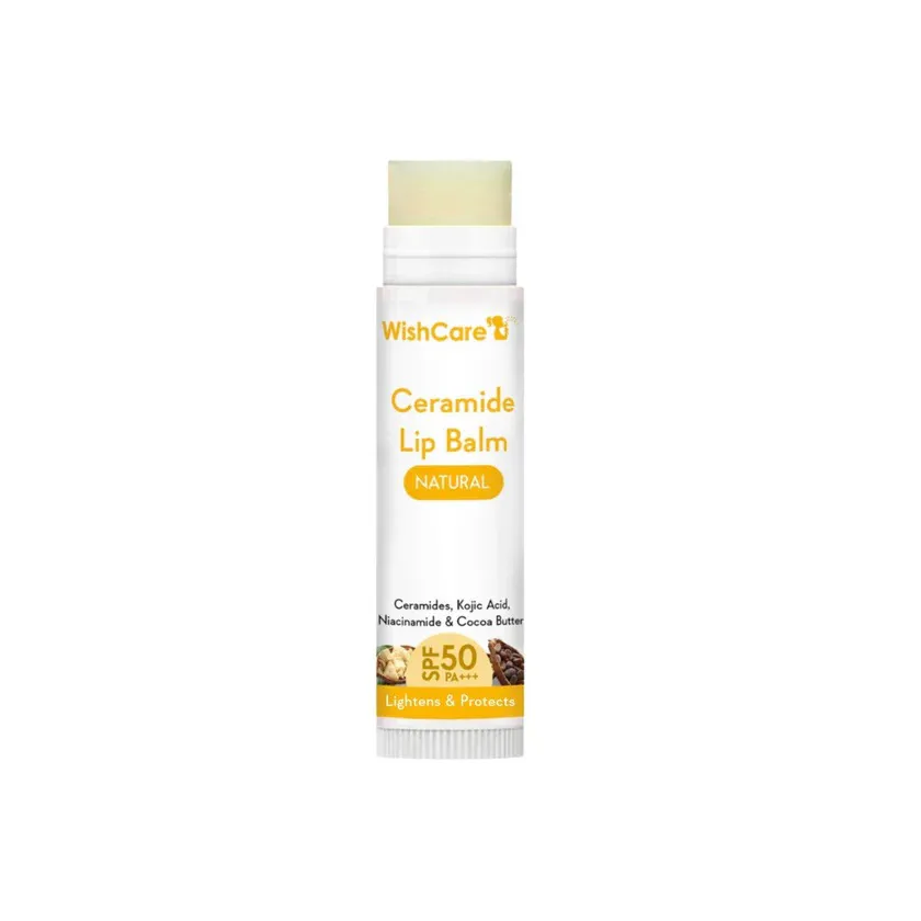 White and yellow tube of ceramide lip balm standing upright on a white background.