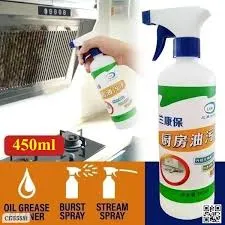 Person spraying a kitchen cleaner on a range hood, bottle with blue and green label shown.