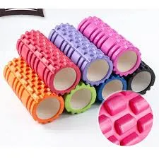 Colorful textured foam rollers stacked together, with a close-up of the surface pattern.