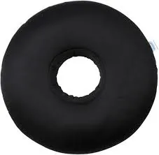 Black donut-shaped cushion with a hole in the center.