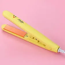 Yellow hair straightener with orange plates on a pink background.