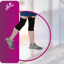Person wearing black knee supports and gray sneakers on a blurred indoor background.