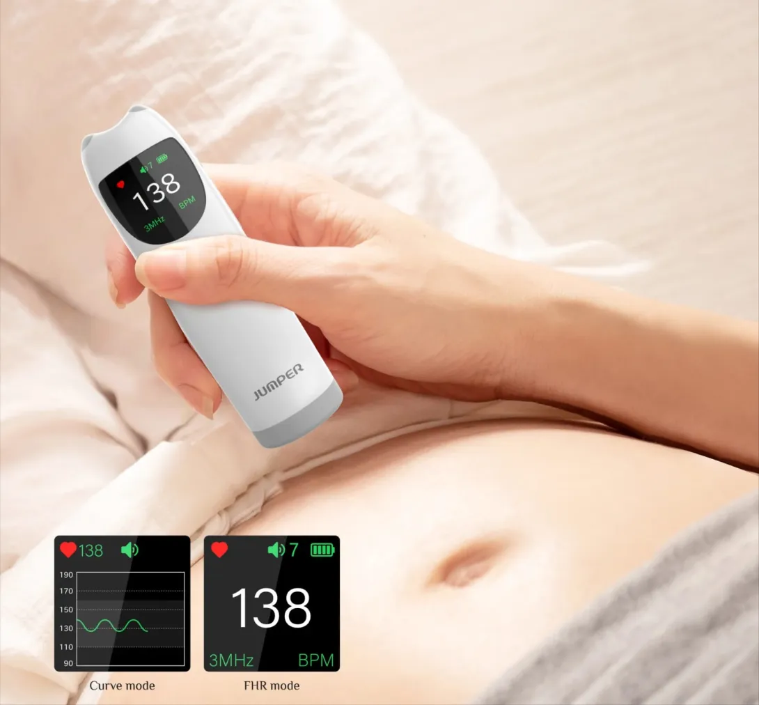 Hand holding digital fetal doppler against a pregnant belly, device screen shows heart rate.