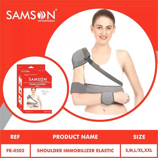 Woman wearing a gray shoulder immobilizer elastic with product packaging shown.